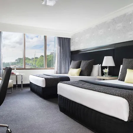 Pullman Brisbane King George Square Hotel Exterior photo A room at the Hotel Metropole